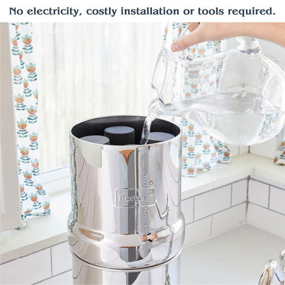 Pouring water into the upper chamber of a Berkey system on a kitchen counter